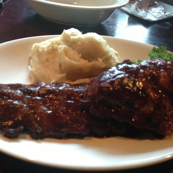 Photo taken at Bâton Rouge Steakhouse &amp; Bar by Sacha L. on 7/15/2013