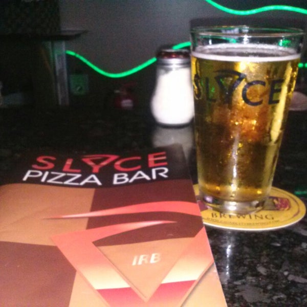 Photo taken at Slyce Pizza Bar by Gena G. on 7/28/2013