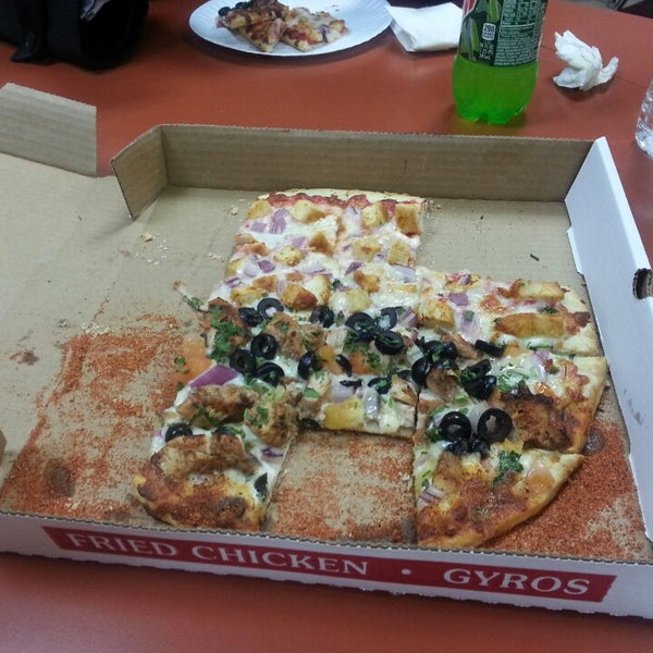 Photo taken at Amar pizza by Scott B. on 10/28/2014