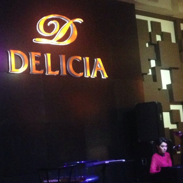 Photo taken at Delicia by Inara A. on 11/8/2014