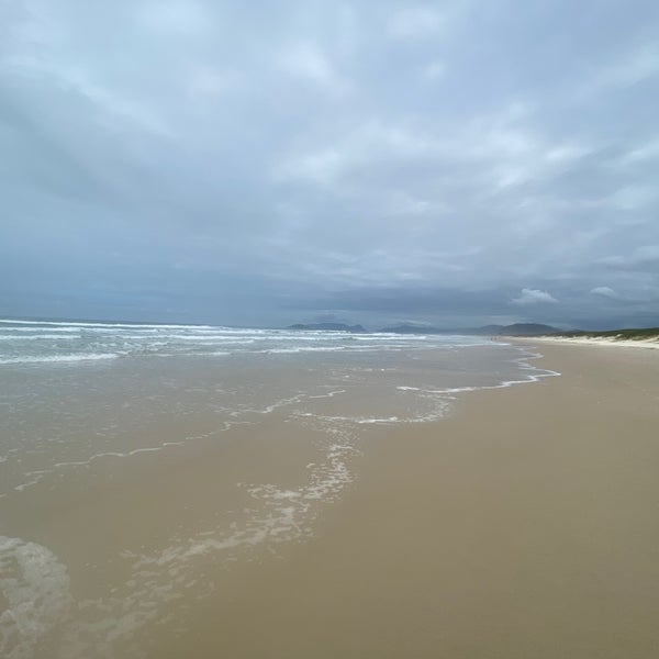 Photo taken at Praia da Joaquina by Mari on 4/6/2022