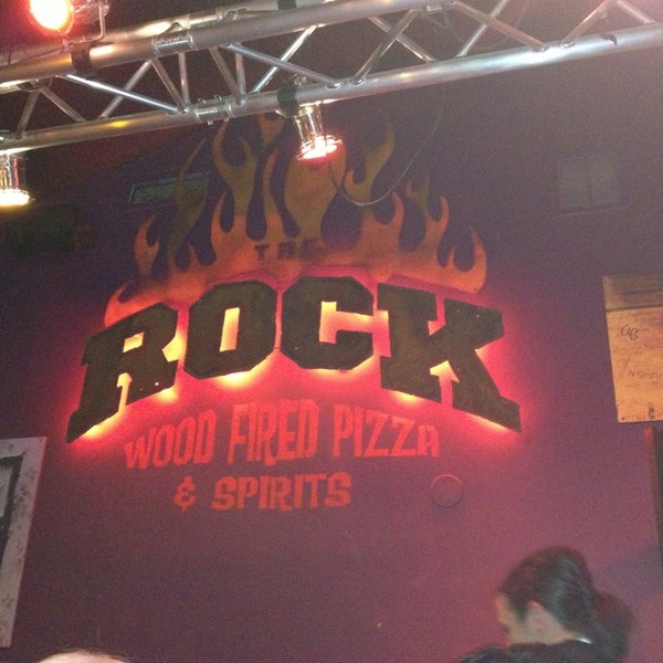 Photo taken at The Rock Wood Fired Pizza by Edilene C. on 6/23/2013