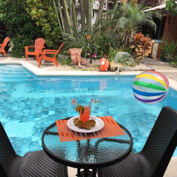 Boutique lodgings for adult lifestyle inclusive guests with varied rooms and rates plus Resto-Pool-Bar Media Naranjo to enjoy poolside drinks and dining while enjoying courtyard garden area.