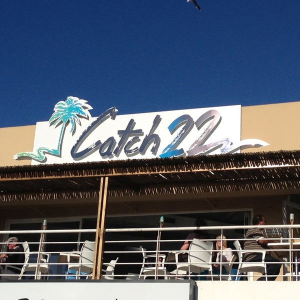 Photo taken at Catch22 Beachside Grille &amp; Bar by Maggie B. on 8/25/2013