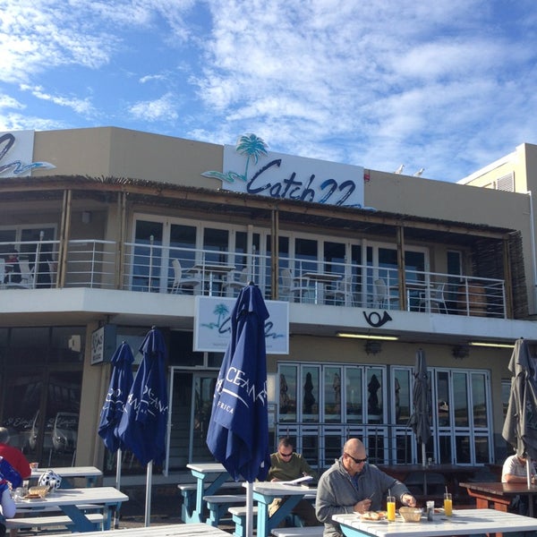 Photo taken at Catch22 Beachside Grille &amp; Bar by Maggie B. on 6/30/2013