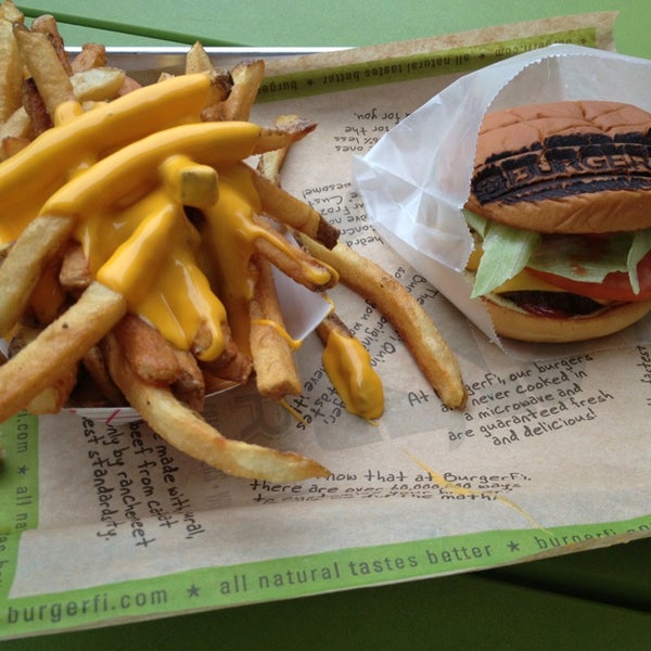 Photo taken at BurgerFi by Hassan C. on 6/11/2013