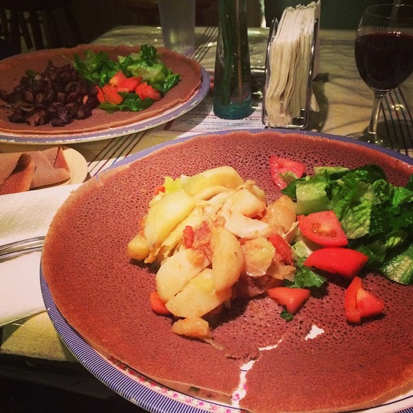 Photo taken at Mudai Ethiopian Restaurant by Valéria Falcao A. on 12/13/2014