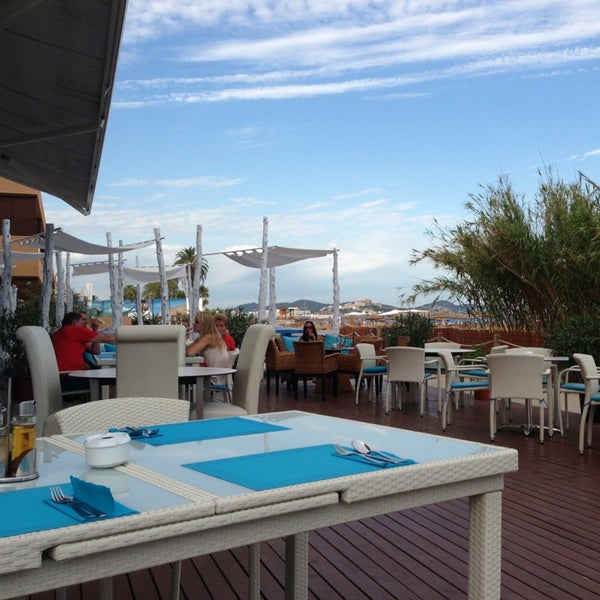 Photo taken at St.Tropez Beach Bar &amp; Restaurant IBIZA by Tatiana N. on 8/13/2013