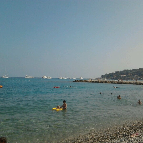 Photo taken at Plage de Roquebrune Cap Martin by GAELLE K. on 8/5/2013