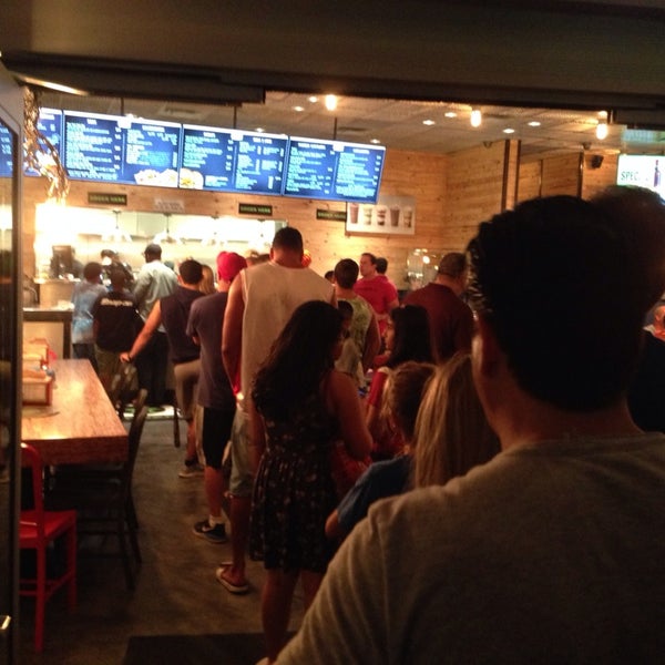 Photo taken at BurgerFi by Kj N. on 8/7/2014