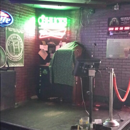 Photo taken at O&#39;Shucks Pub &amp; Karaoke Bar by Tommy F. on 6/14/2013