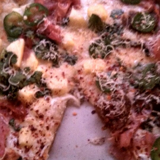 Photo taken at Brixx Wood Fired Pizza by Kim O. on 3/27/2014