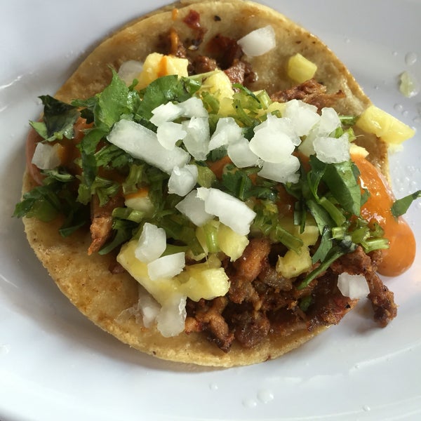 Taco al pastor. I got to put cilandro, onions, pineapple and salsa to taste. Just the way I like it.