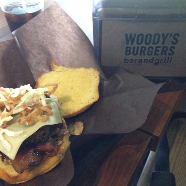 Photo taken at Woody&#39;s Burgers bar and grill by Clarissa on 6/11/2015