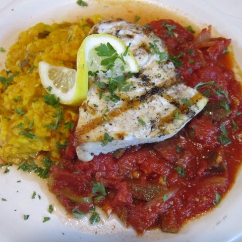 Our fresh catch this evening is a Grilled Swordfish, served over seafood risotto and spicy tomato sauce.