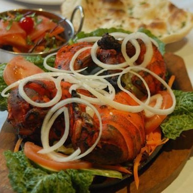 Try their savory dishes, such as their Tandoori Chicken! You can order takeout or delivery online from this restaurant!