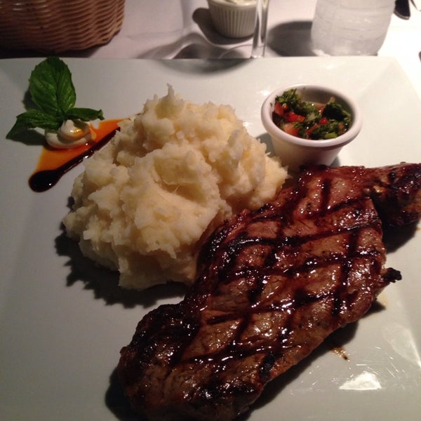 Photo taken at New Campo Argentino Steakhouse by Daniele S. on 11/12/2013
