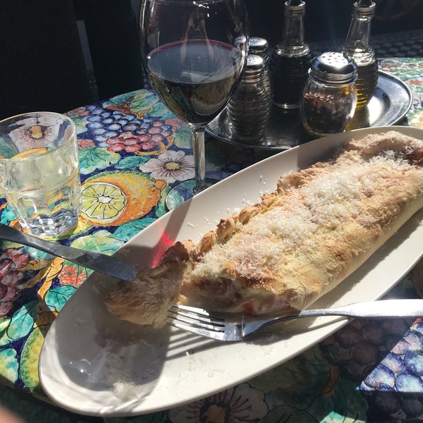 Outside tables are awesome on a shiny hot day. Also my calzone Italian was perfect with a glass of red wine.
