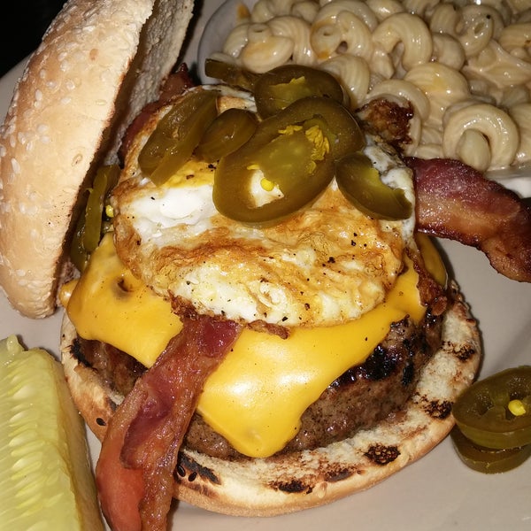 Angus burger with fried egg and jalapenos