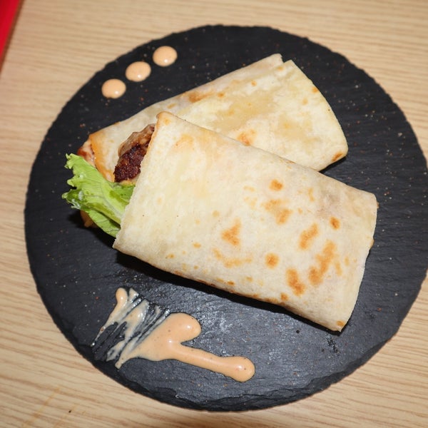 You've got to try Metroyal by METROLLS.It's a freshly made cheese bread wrap with juicy burger patty, cheese, special sauces, lettuce and tomatoes.