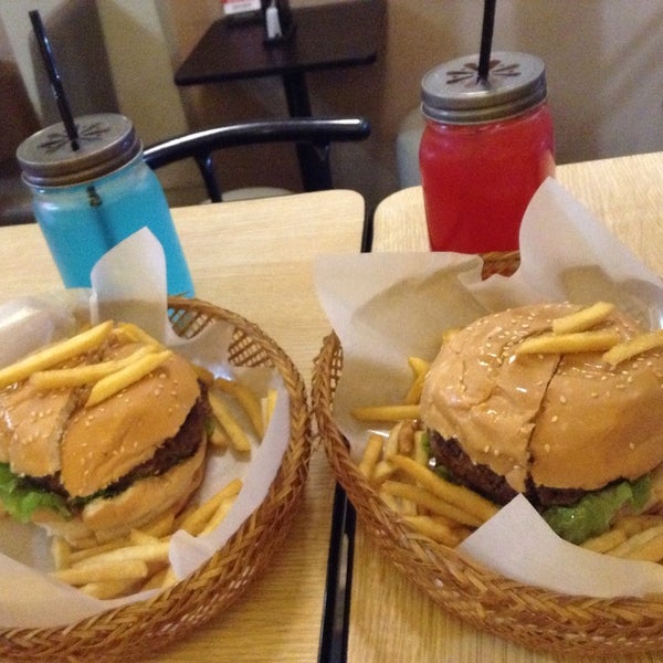 Photo taken at Stuff Over Burger Cafe by Patricia N. on 8/16/2014