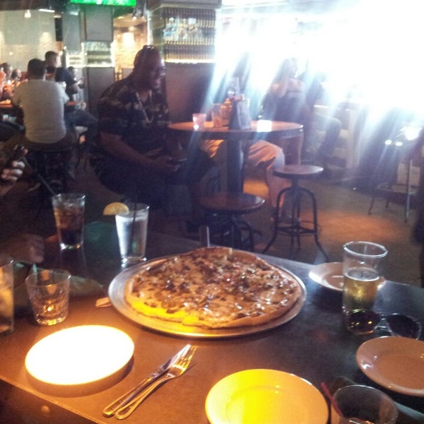 Photo taken at Bombshells Restaurant &amp; Bar by Christopher F. on 9/14/2013