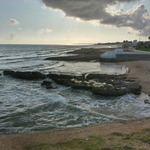 Photo taken at Praia dos Gémeos by Pedro O. on 7/19/2014