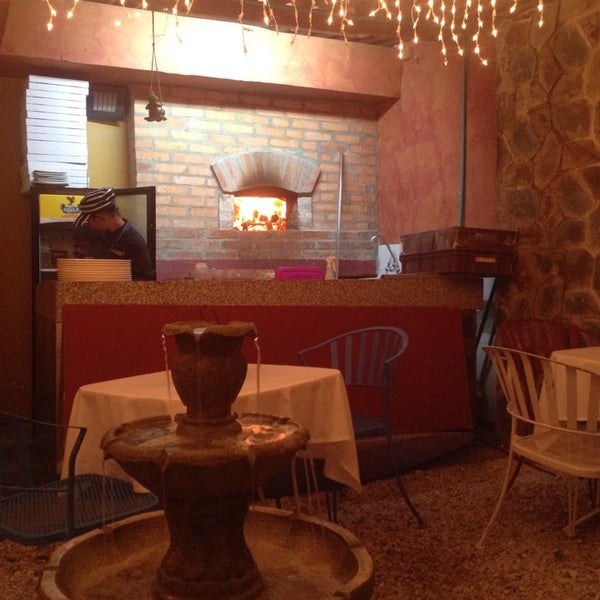 Photo taken at Da Luigi Trattoria Pizzeria by Draysa C. on 12/29/2013