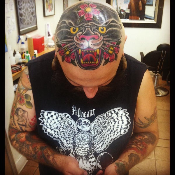 9/11/2015 tarihinde Keven J.ziyaretçi tarafından Champion Tattoo Company'de çekilen fotoğraf