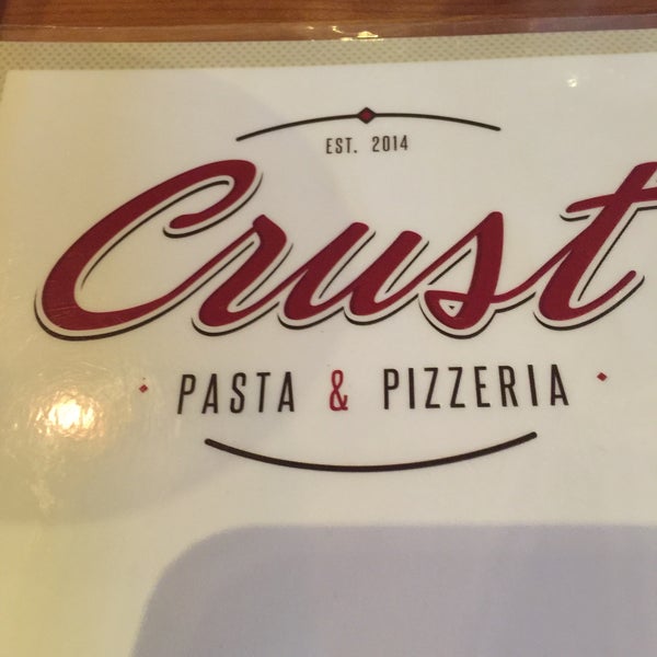 Photo taken at Crust Pasta &amp; Pizzeria by Steve O. on 5/9/2016