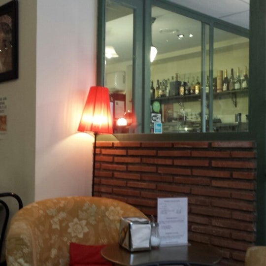 Photo taken at La Qarmita Librería-Café by Aya P. on 1/30/2014