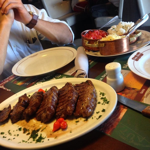 Photo taken at Santa Brasa Authentic Steaks by Rafael A. on 9/4/2014
