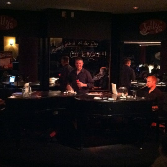 Photo taken at Jolly&#39;s American Beer Bar and Dueling Pianos by Laura M. on 11/19/2011