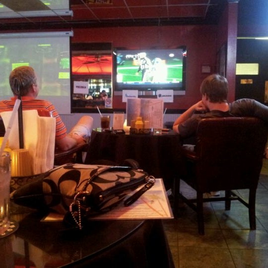 Photo taken at Players Sports Bar &amp; Grille by Matt K. on 12/18/2011