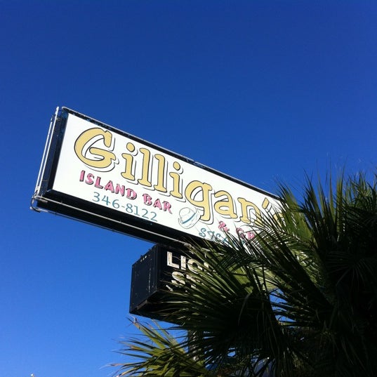 Photo taken at Gilligan&#39;s Island Bar and Grill by Ron B. on 1/30/2012