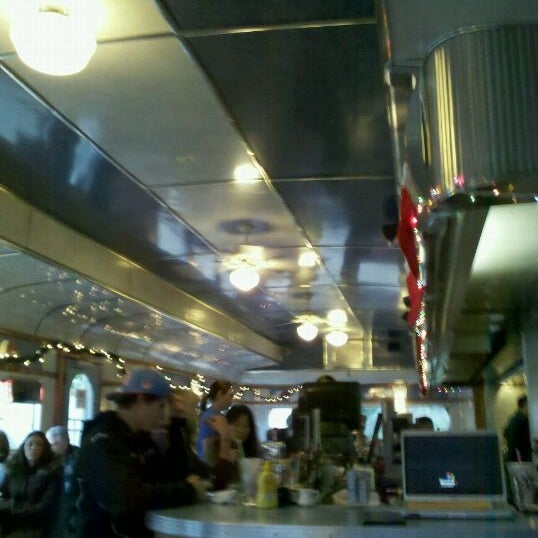 Photo taken at The Madison Diner by Garrett Y. on 12/26/2011
