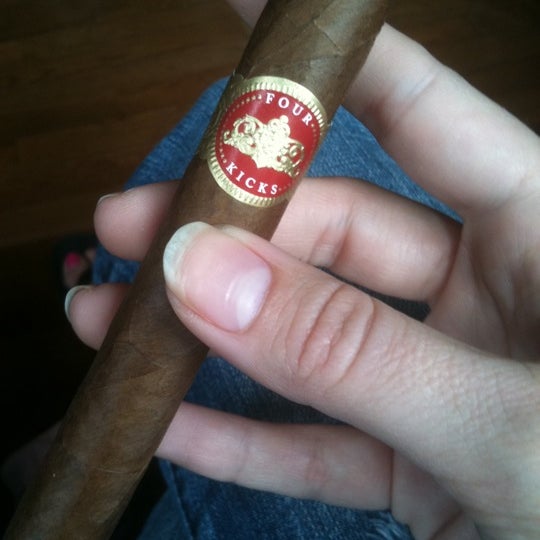 Photo taken at Burns Tobacconist Downtown by Erin on 3/31/2012