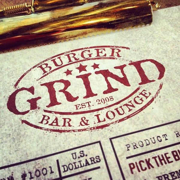 Photo taken at Grind Burger Bar &amp; Lounge by Greg B. on 7/20/2012