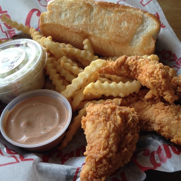Photo taken at Raising Cane&#39;s Chicken Fingers by Brad T. on 6/26/2014