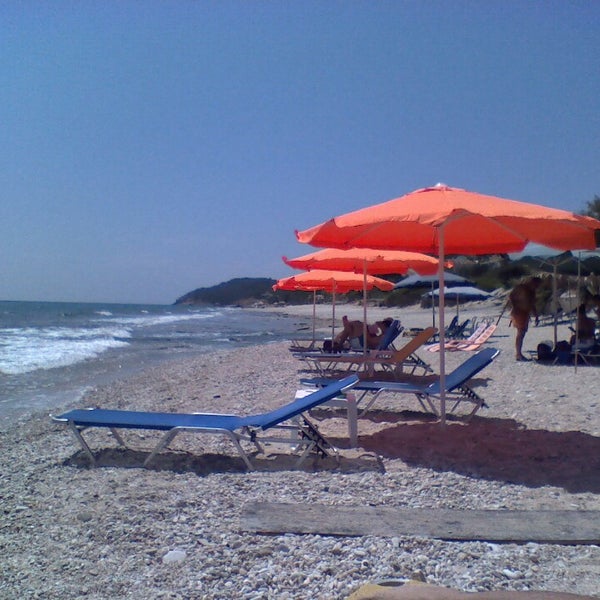 Photo taken at Stelakis Beach by Alejandra C. on 7/10/2013