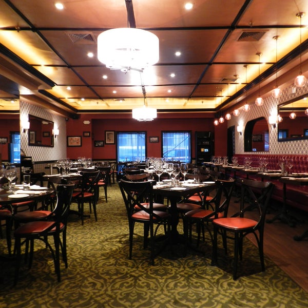The midtown sister to the legendary downtown NYC steakhouse features modern updates on menu favorites, from onion rings topped in blue cheese to a double decker prime steak “hamburger.”