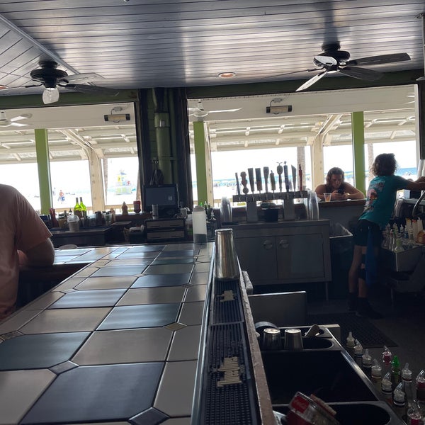 Photo taken at Palm Pavilion Beachside Grill &amp; Bar by Deshawn F. on 9/28/2021
