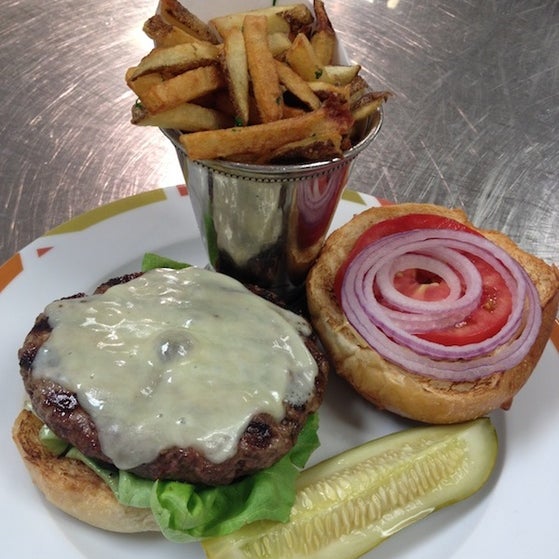 The burger is grilled until it gets just the right amount of char. It's served between a locally sourced brioche bun topped with aged white cheddar, housemaid burger sauce, LTO, and a pickle spear.