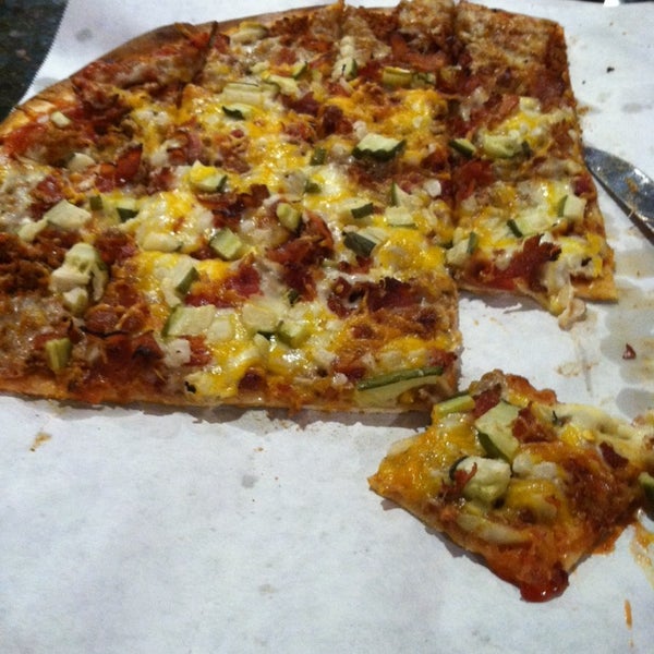 Photo taken at Tasty Pizza - Hangar 45 by natasha p. on 12/27/2013