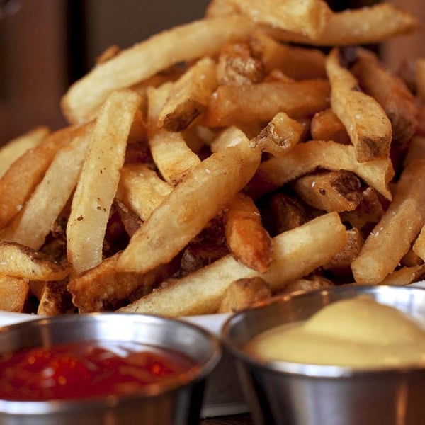 They're double-blanched and fried to order in a canola-vegetable oil blend. These fries accompany the Rowdyburger and, of course, steak frites. You can order them "wet" with brown gravy, too.