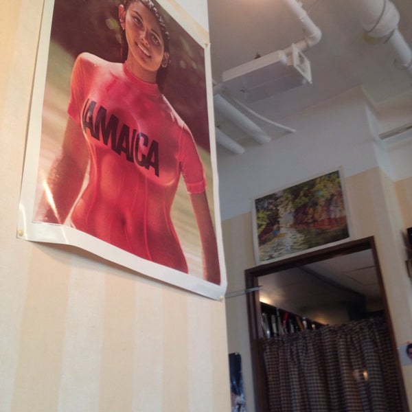 Photo taken at JamRock Cafe &amp; Restaurant by Dan C. on 4/12/2014
