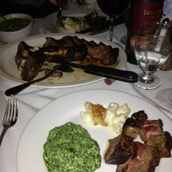 Photo taken at Dino &amp; Harrys Steakhouse by Mike T. on 3/29/2013