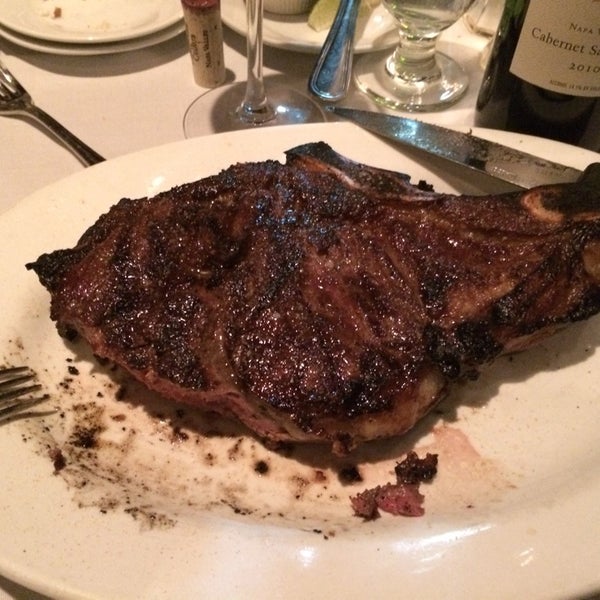 Photo taken at Dino &amp; Harrys Steakhouse by Craig H. on 2/22/2014