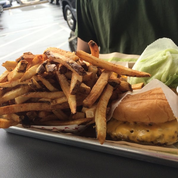 Photo taken at BurgerFi by Rachel A. on 7/4/2014