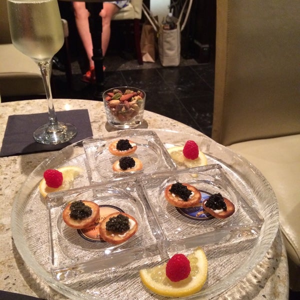 Photo taken at OLMA Caviar Boutique &amp; Bar at The Plaza Food Hall by Norman E. on 6/27/2014